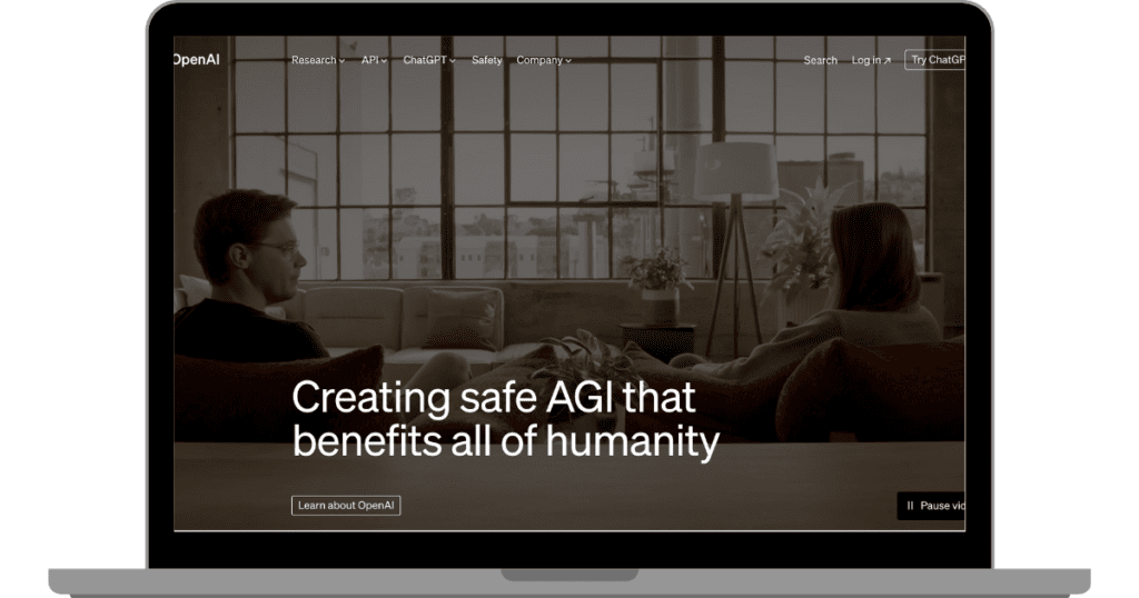 Homepage of OpenAI presented on a laptop screen, emphasizing 'Creating safe AGI that benefits all of humanity', showcasing the company's focus on safety in AI writer technology.